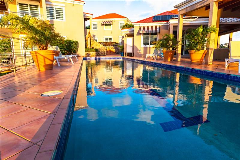Pool terrace with panoramic harbor views at Ocean Pointe Caribe private villa, St Thomas