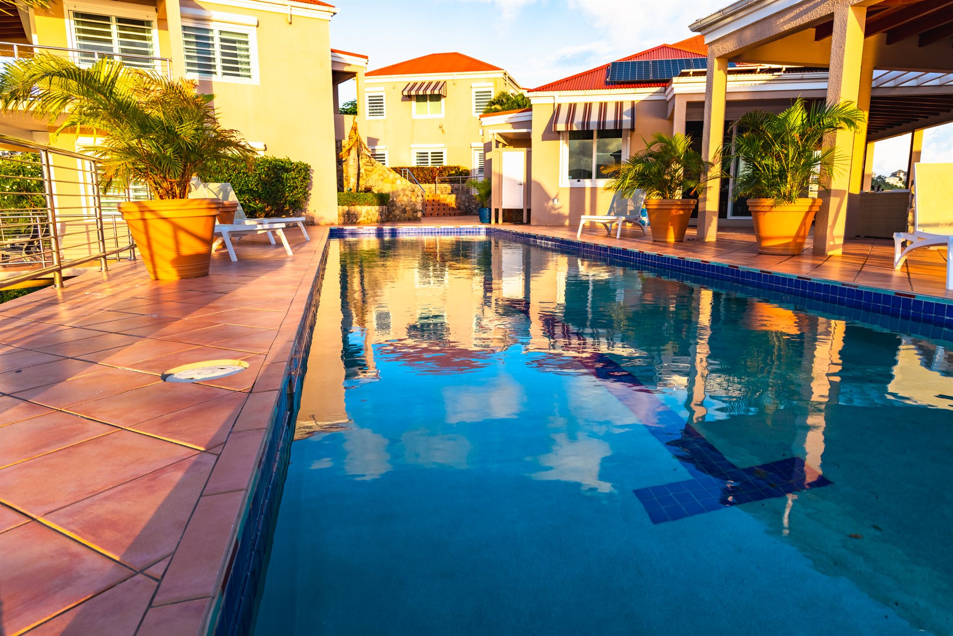 Pool terrace with panoramic harbor views at Ocean Pointe Caribe private villa, St Thomas